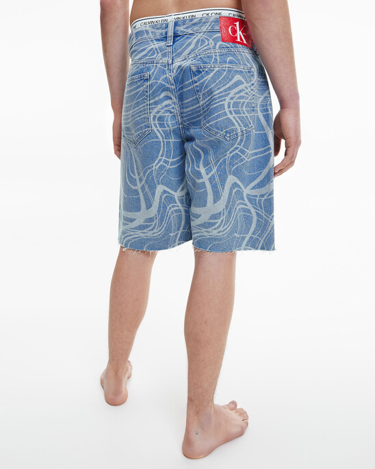 CK ONE DISRUPTED LOGO WIDE DENIM SHORTS
