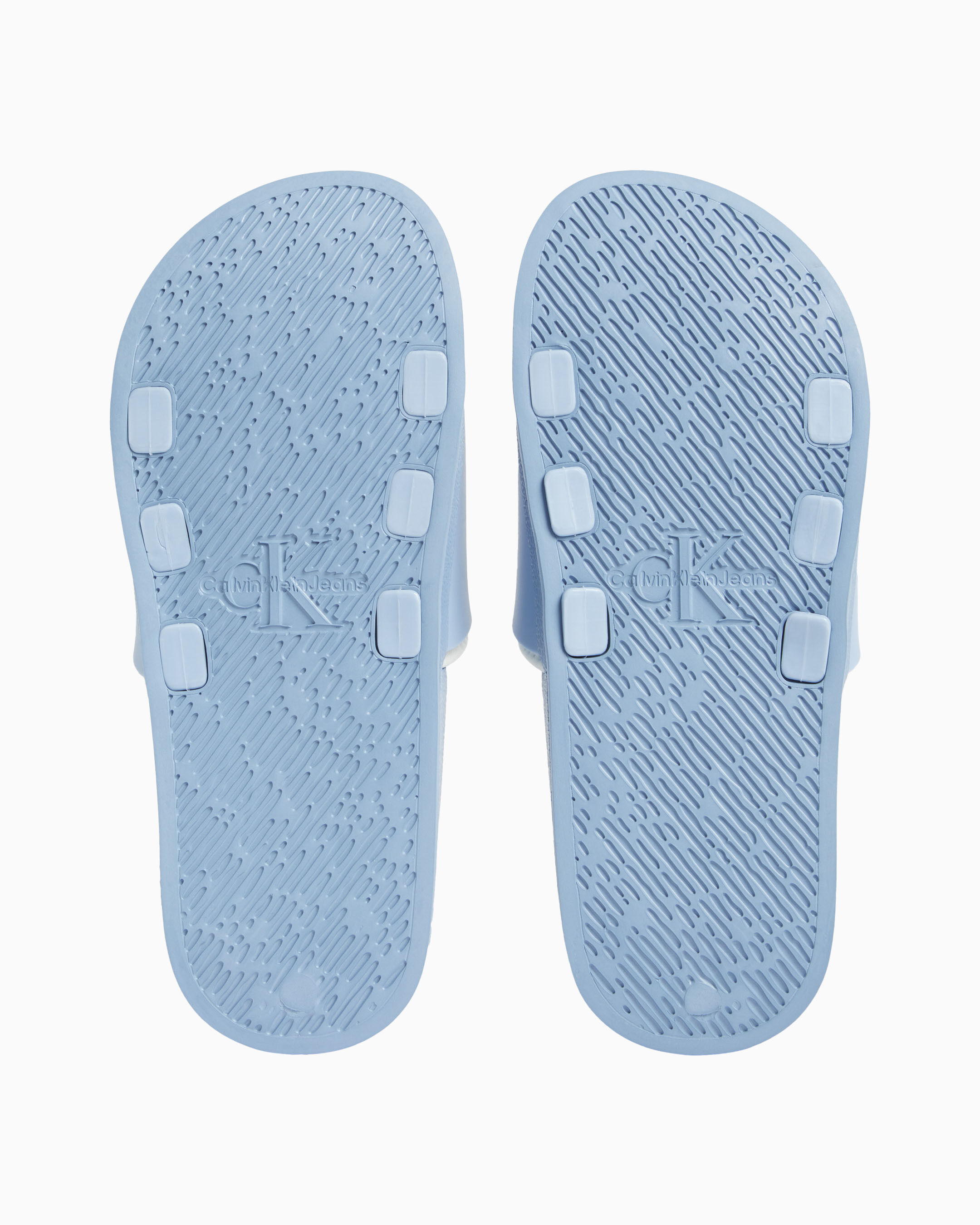White calvin klein flip flops top