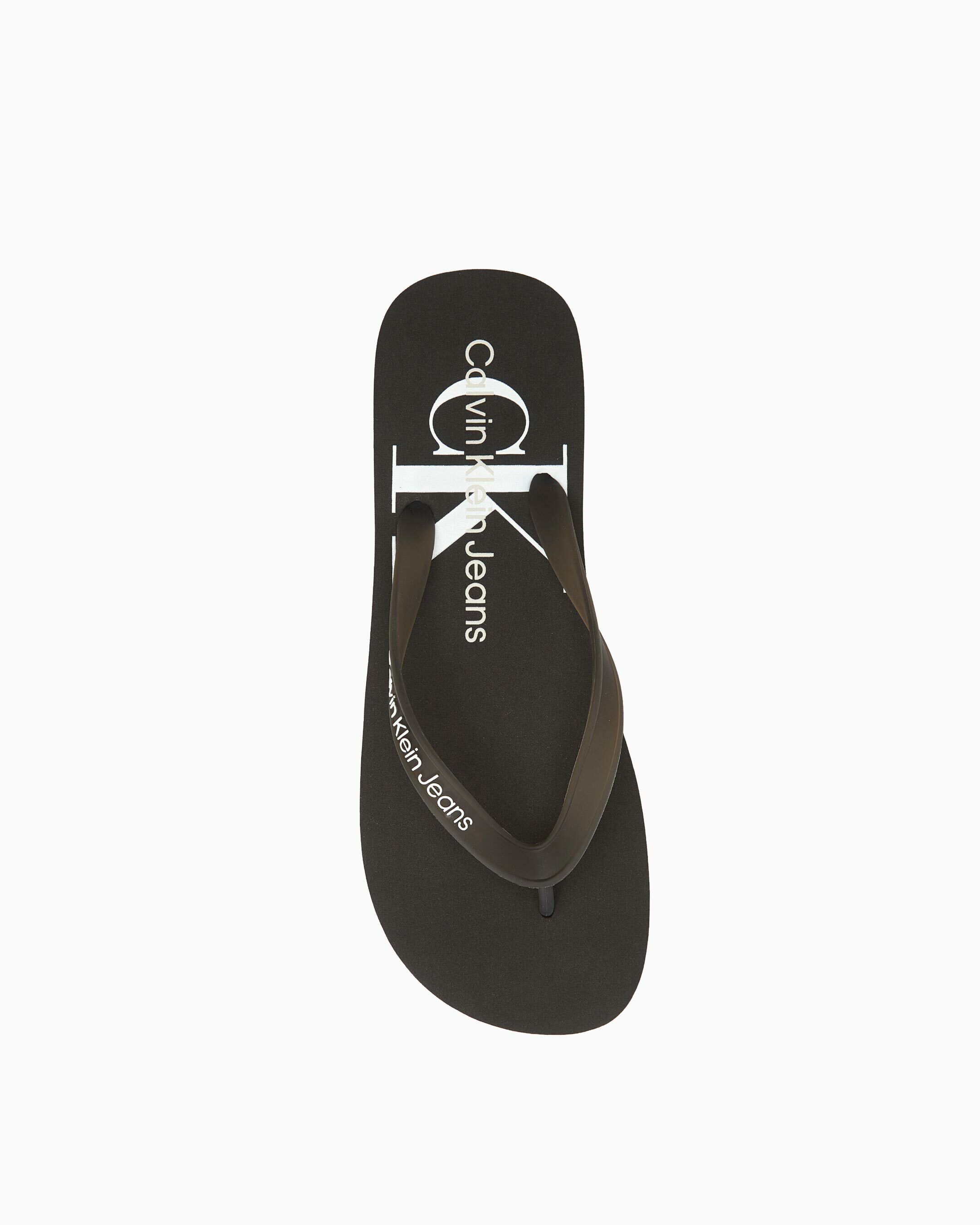 White calvin hotsell klein flip flops