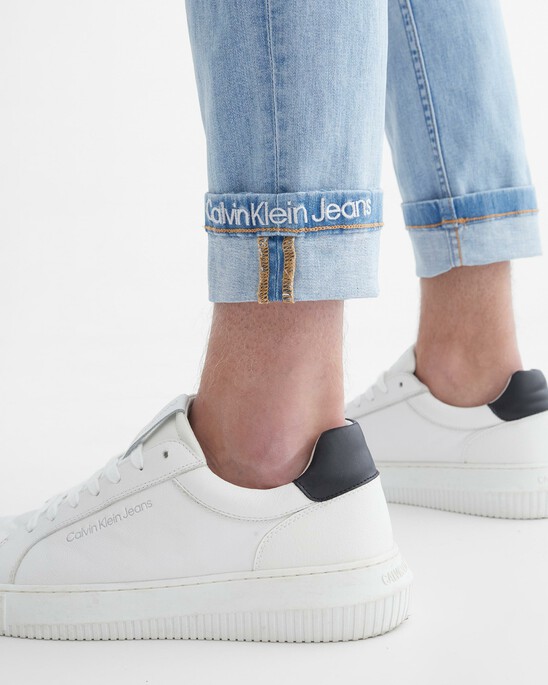 Infinite Flex Distressed Body Taper Jeans