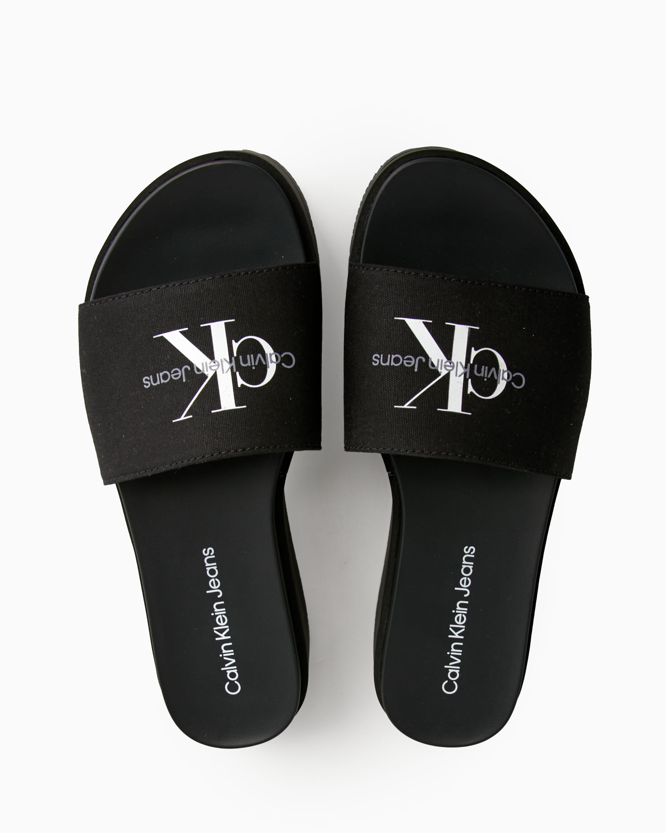 White calvin hotsell klein flip flops