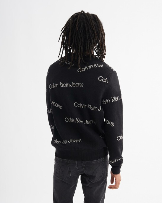 INSTITUTIONAL ALL OVER LOGO SWEATER