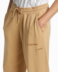 GENDER FLUID DISRUPTED LOGO SWEATPANTS, Tawny Sand, hi-res