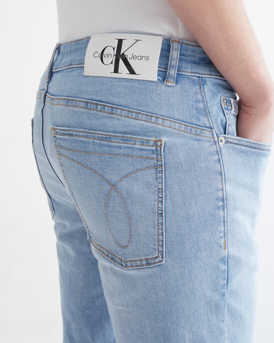 Infinite Flex Distressed Body Taper Jeans